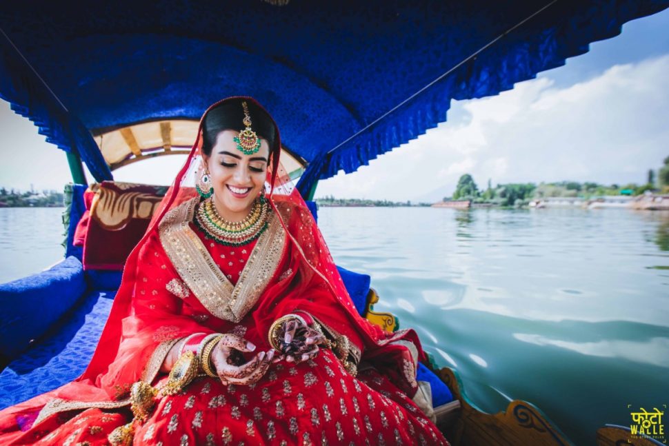 bride on boat in Kashmir at her wedding