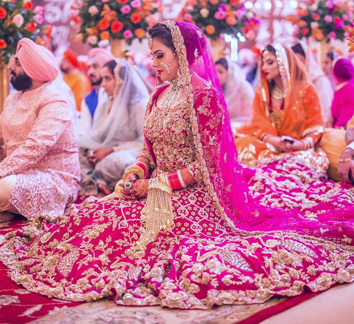 bride sitting for mooh dikhai ritual